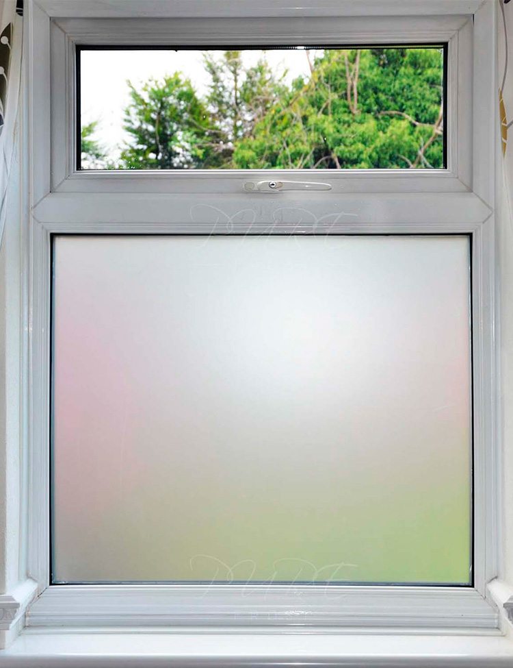 Full image of residential window with frosted white privacy film